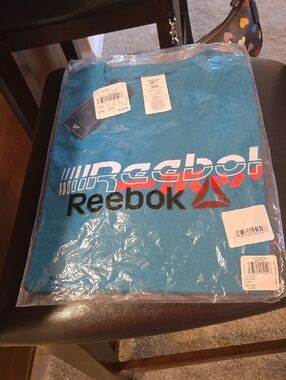 NWT Reebok Teal Graphic Logo Tee with Black and Red Accents